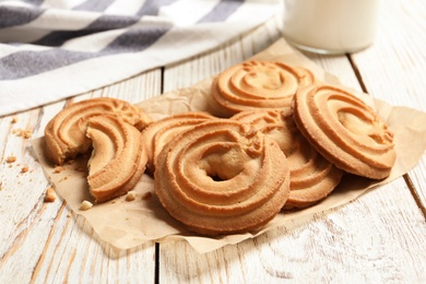 Tasty Danish butter cookies on wooden background