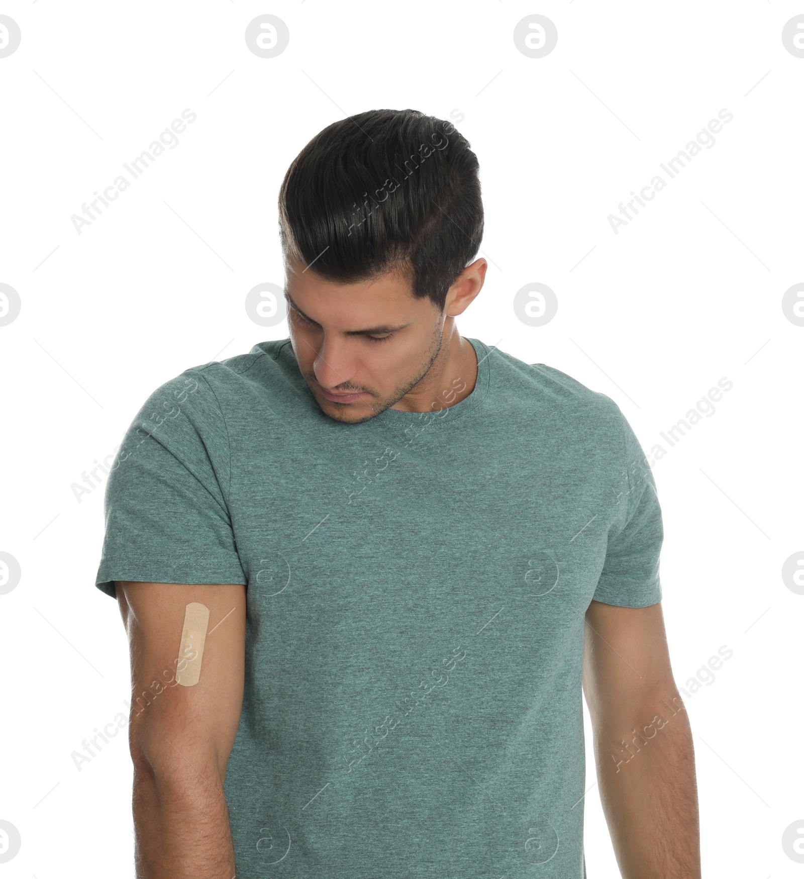 Photo of Man with sticking plaster on arm against white background