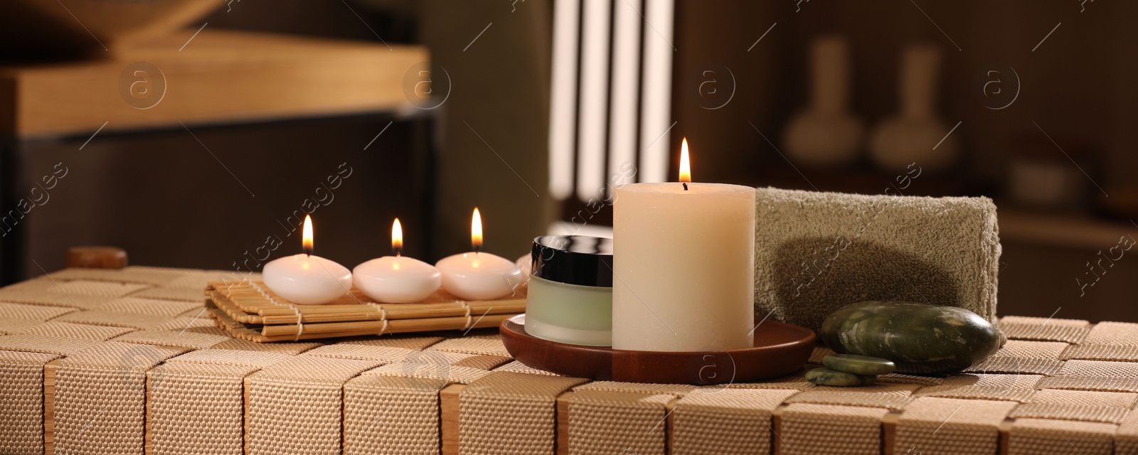 Photo of Beautiful composition with different spa products on wicker bench indoors