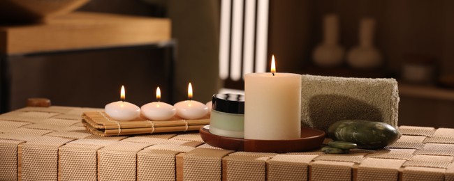 Photo of Beautiful composition with different spa products on wicker bench indoors