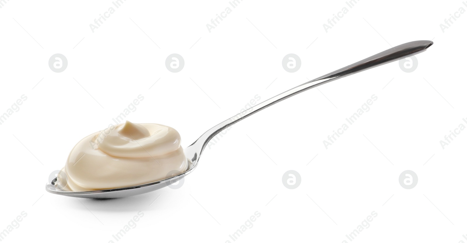 Photo of Natural yogurt in spoon isolated on white