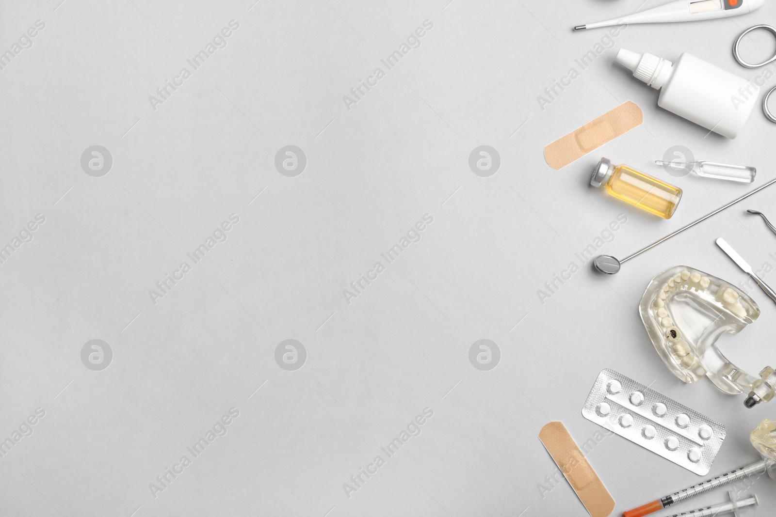 Photo of Flat lay composition with medical items and space for text on color background