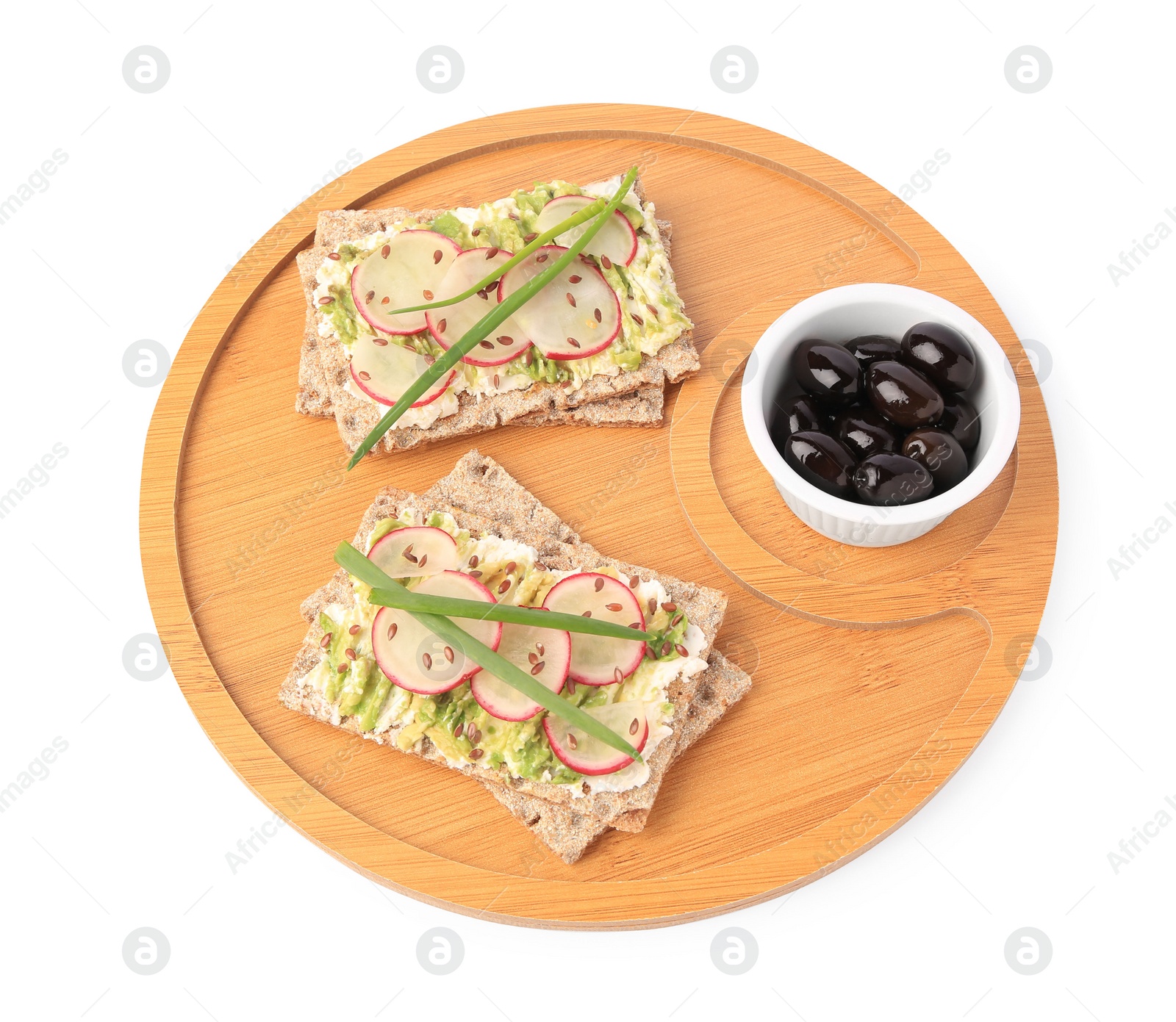 Photo of Fresh crunchy crispbreads with cream cheese, radish, olives and green onion on white background, above view