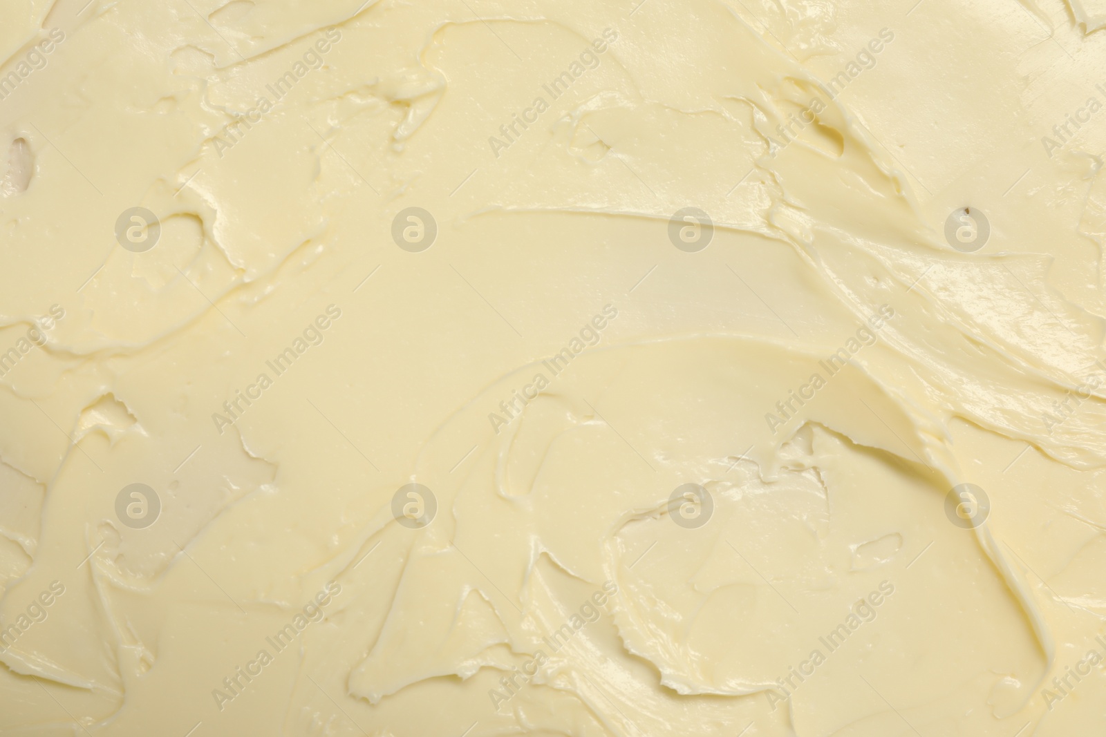 Photo of Texture of fresh natural butter as background, top view