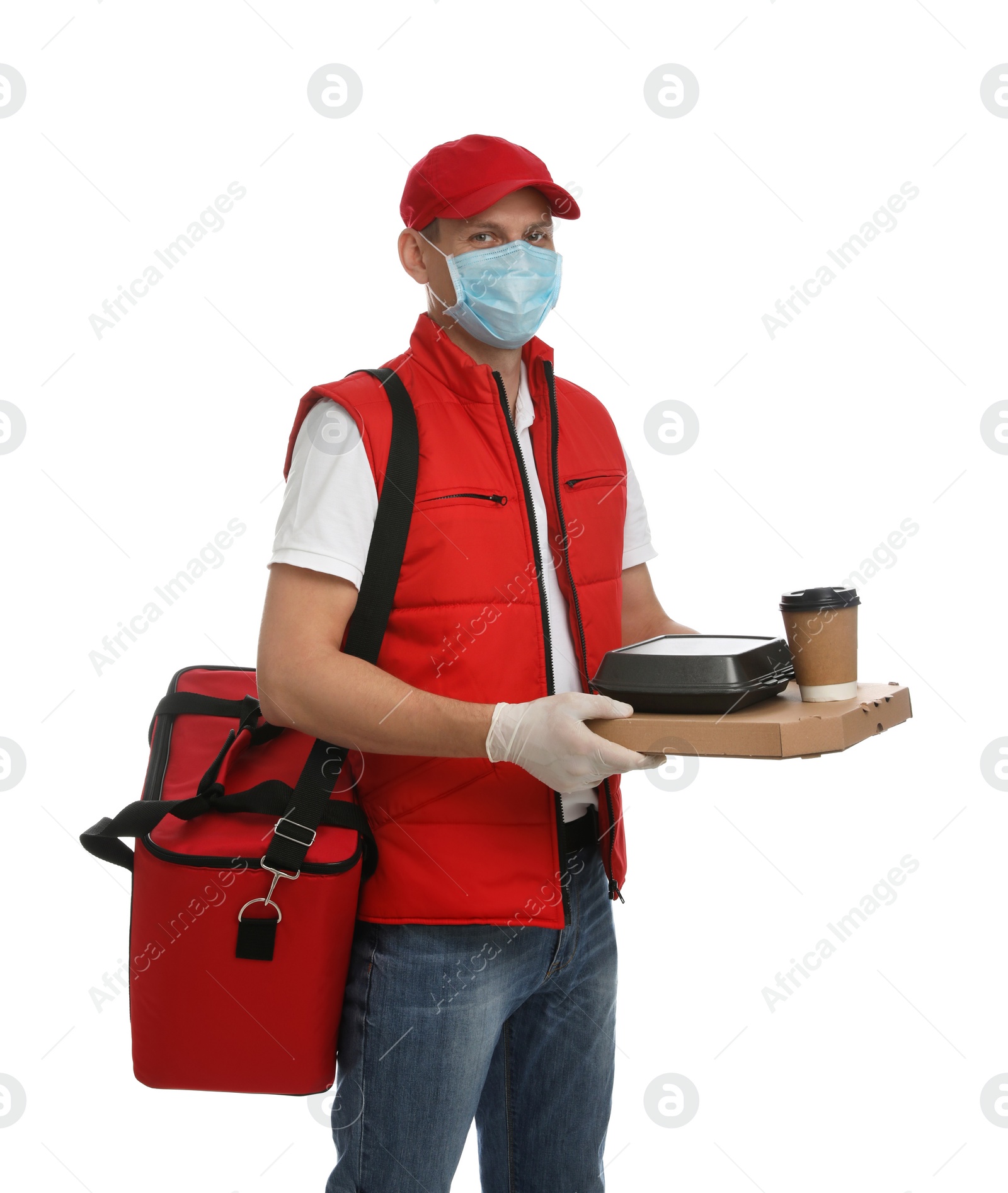 Photo of Courier in protective gloves and mask holding order on white background. Food delivery service during coronavirus quarantine