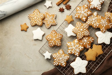 Tasty Christmas cookies with icing and spices on light table, flat lay. Space for text