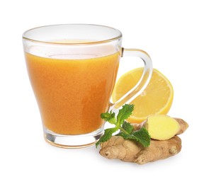 Photo of Glass cup with delicious ginger tea, lemon and mint on white background