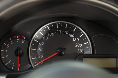 Photo of Speedometer and tachometer on modern car dashboard