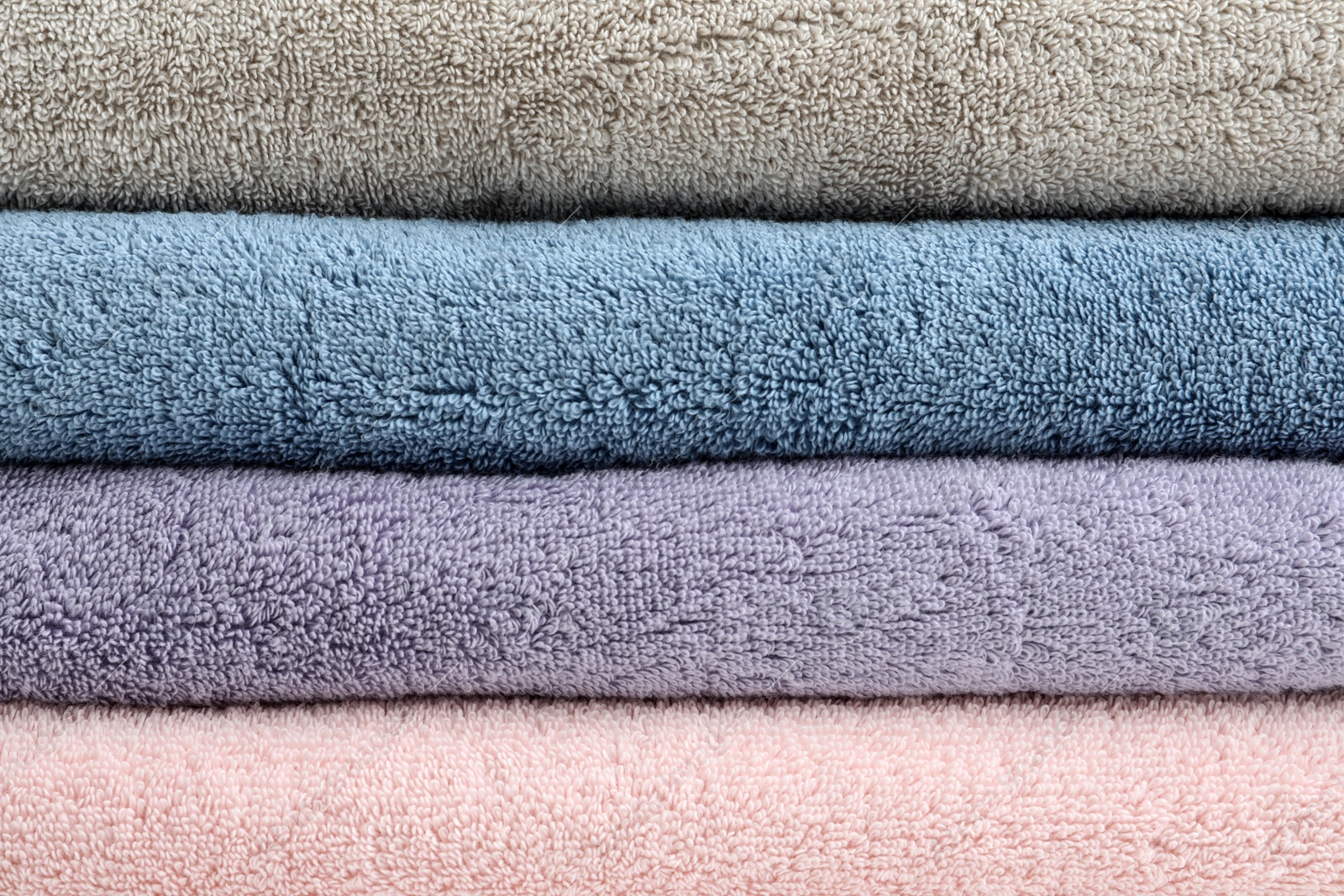 Photo of Stack of clean terry towels as background