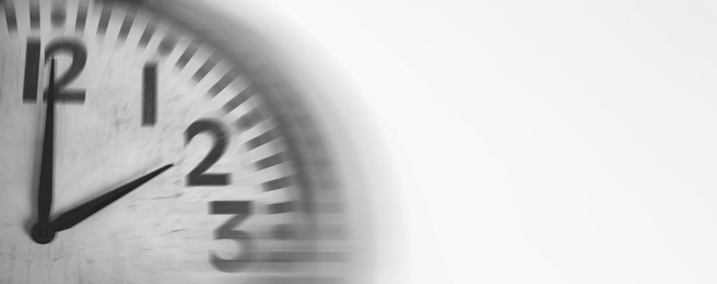 Image of Fleeting time concept. Clock on white background, motion effect. Banner design with space for text