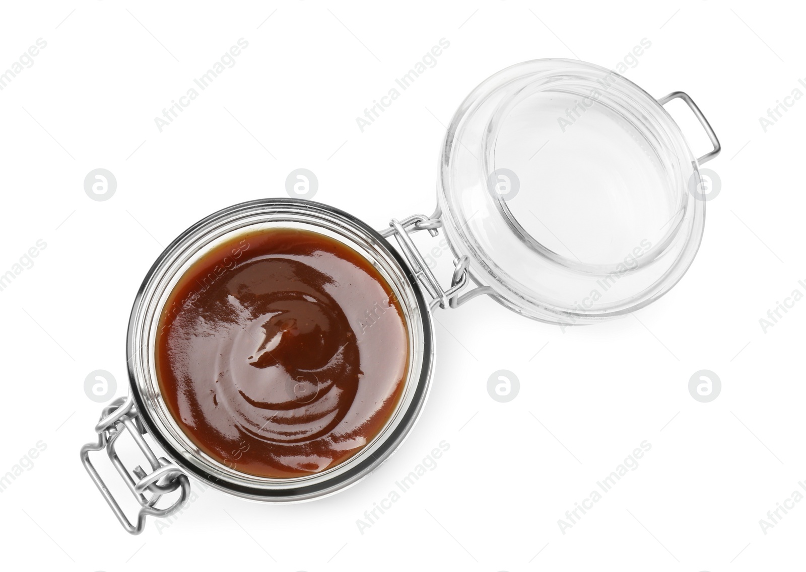 Photo of Tasty barbecue sauce in glass jar isolated on white, top view
