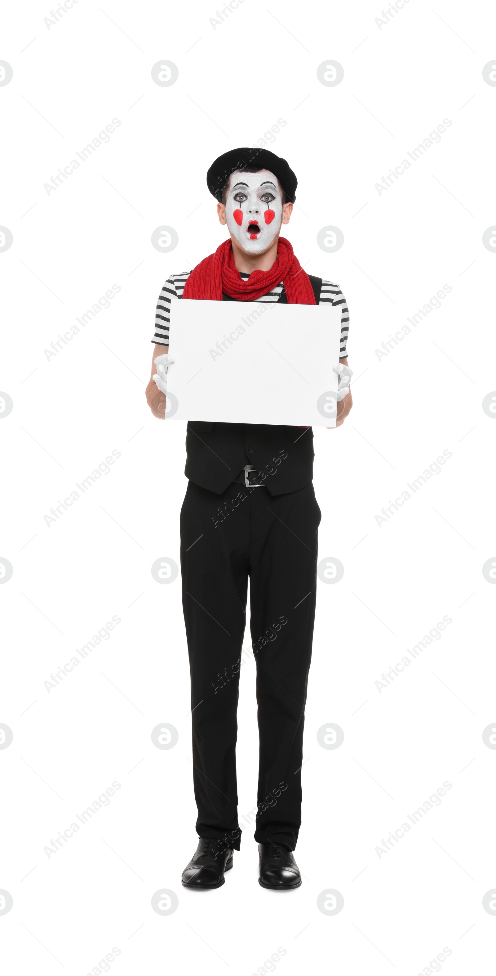 Photo of Mime artist with blank sign making shocked face on white background