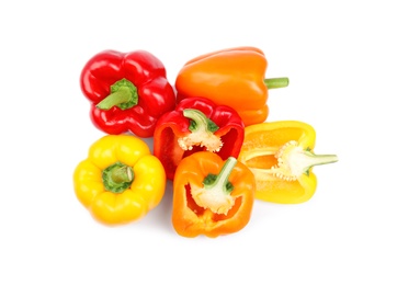 Photo of Whole and cut bell peppers on white background, top view
