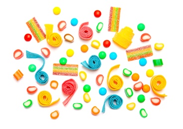 Photo of Composition with different yummy candies on white background, top view