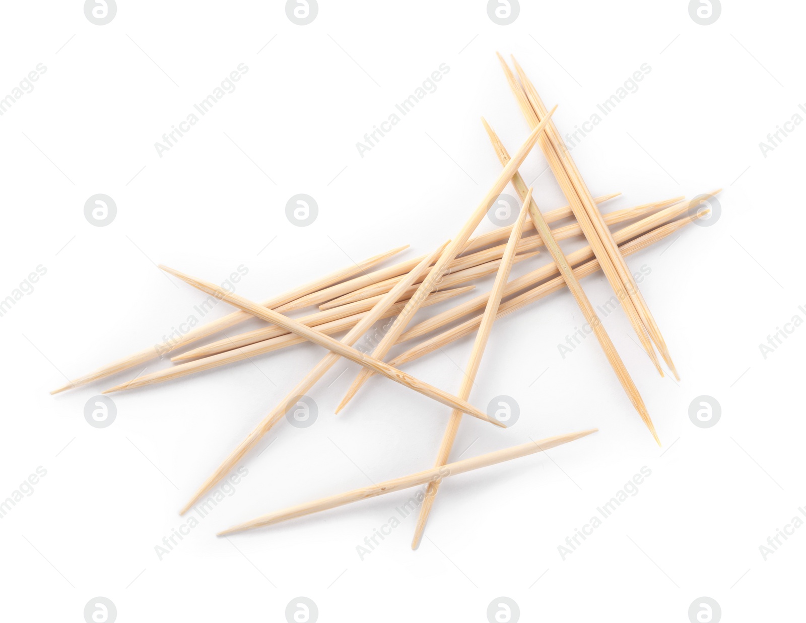 Photo of Heap of wooden toothpicks on white background, top view