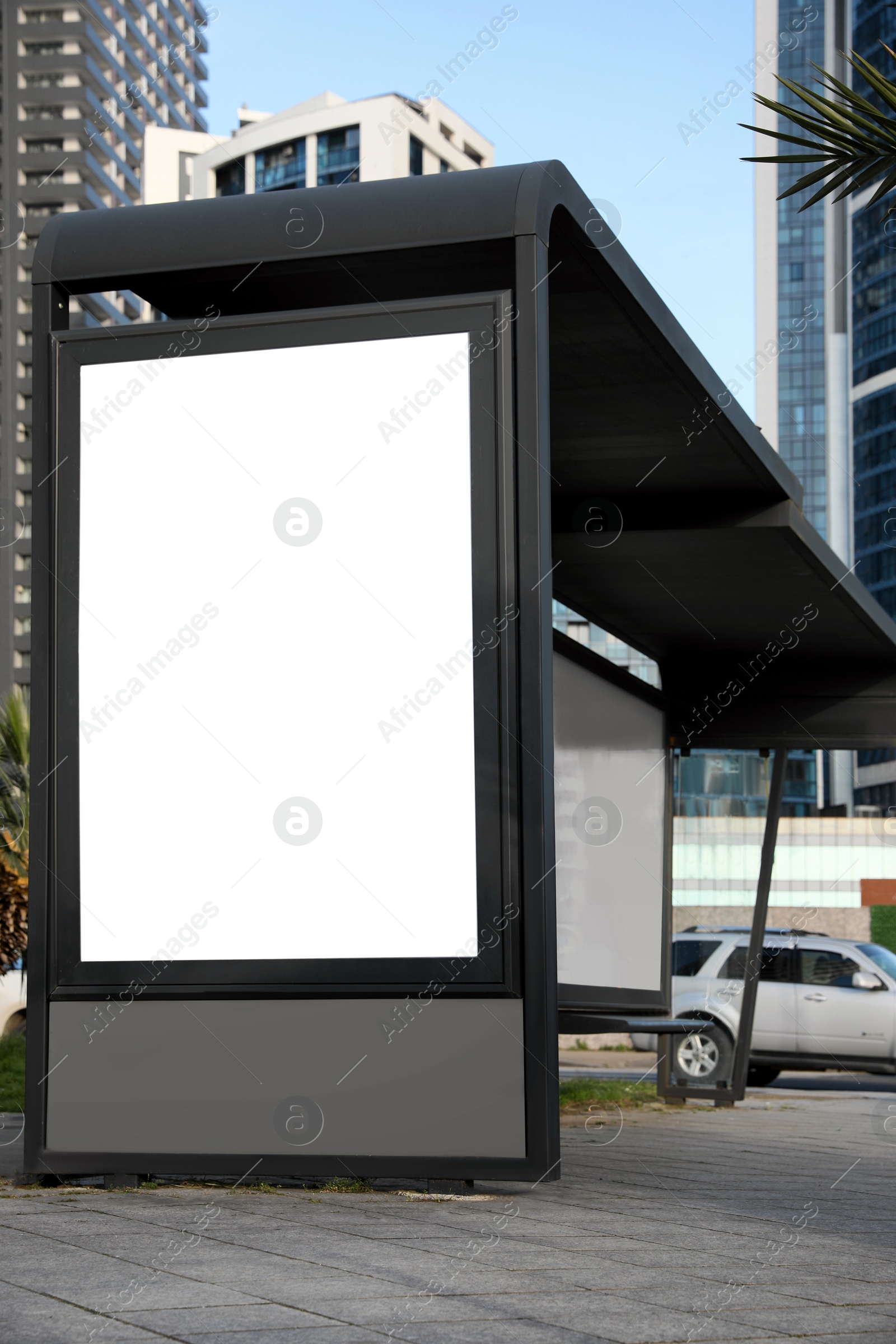 Image of Bus stop with empty signboard in city. Mock-up for design