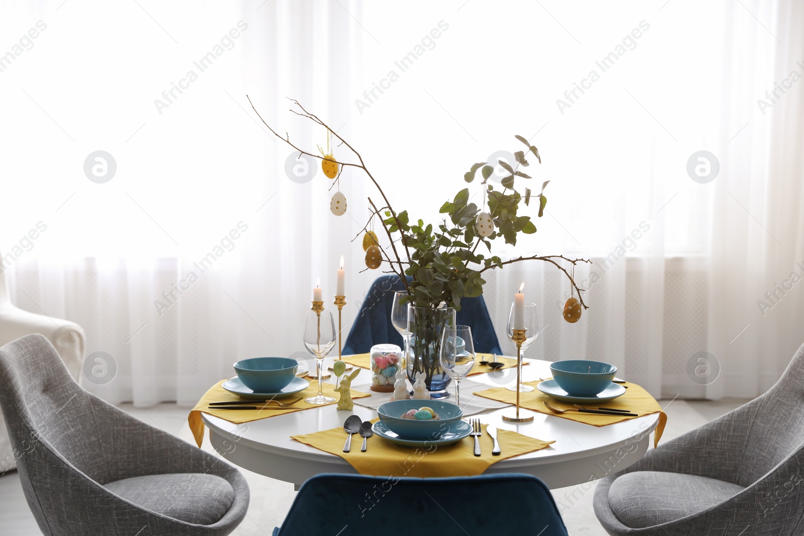 Photo of Beautiful Easter table setting with festive decor indoors