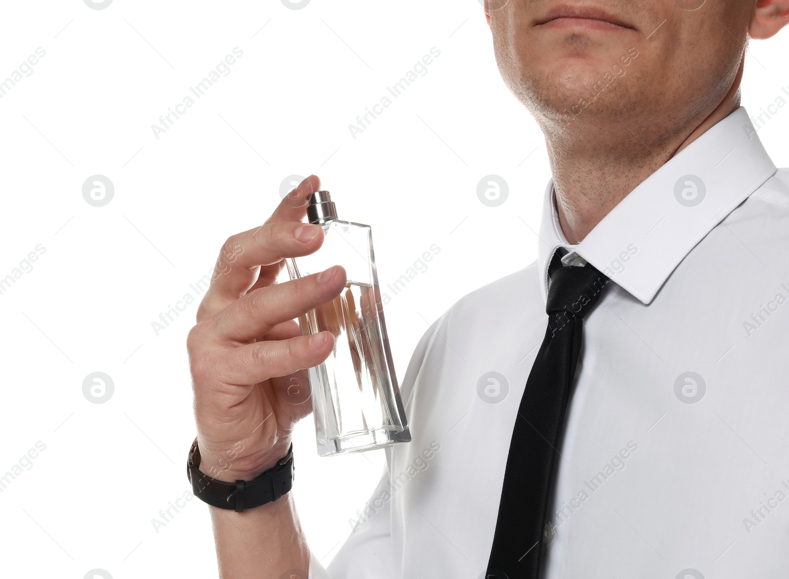 Photo of Handsome man applying perfume on neck against white background, closeup