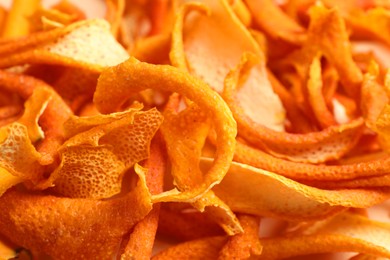 Many dry orange peels as background, closeup