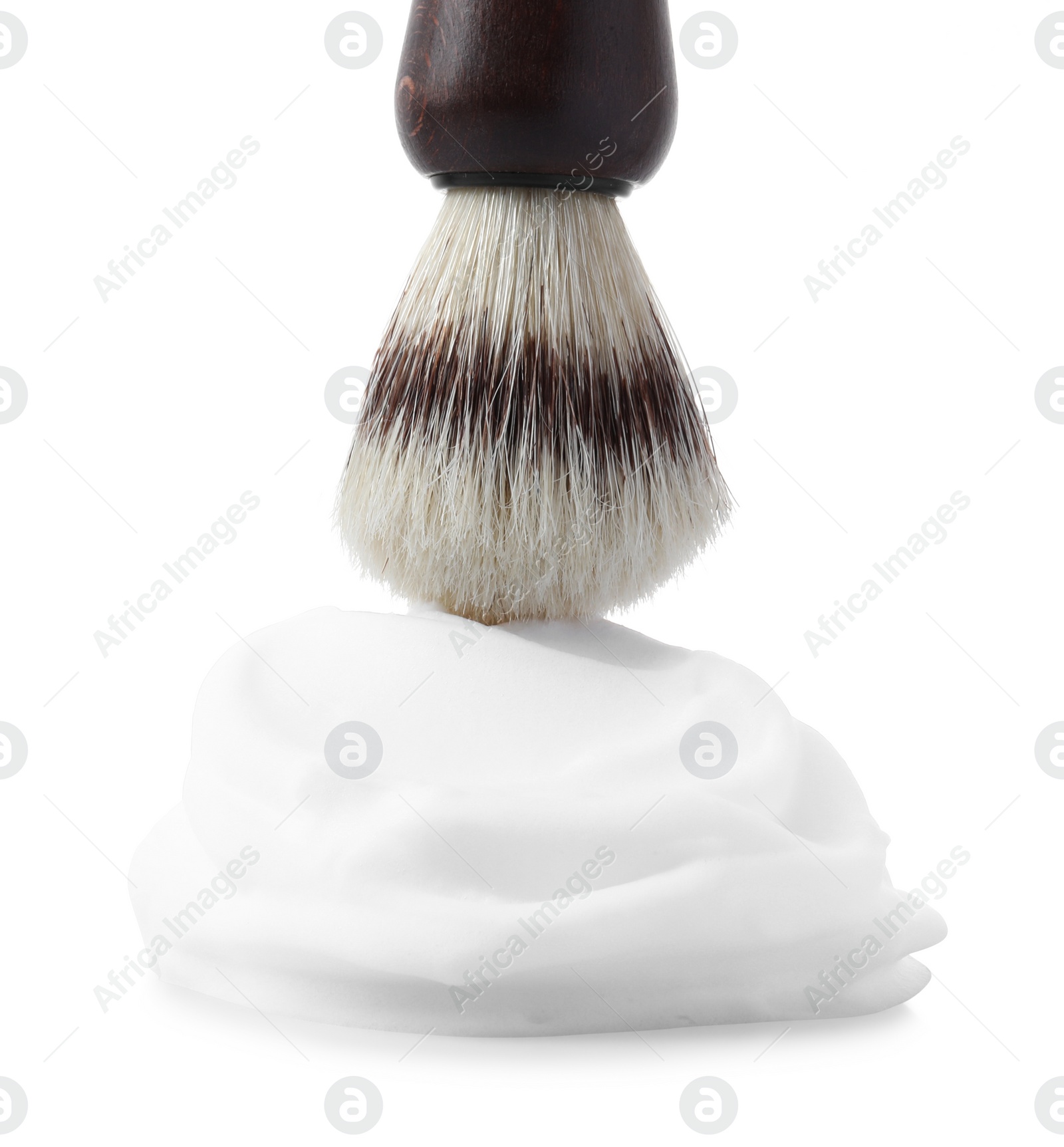 Photo of Shaving foam and brush on white background