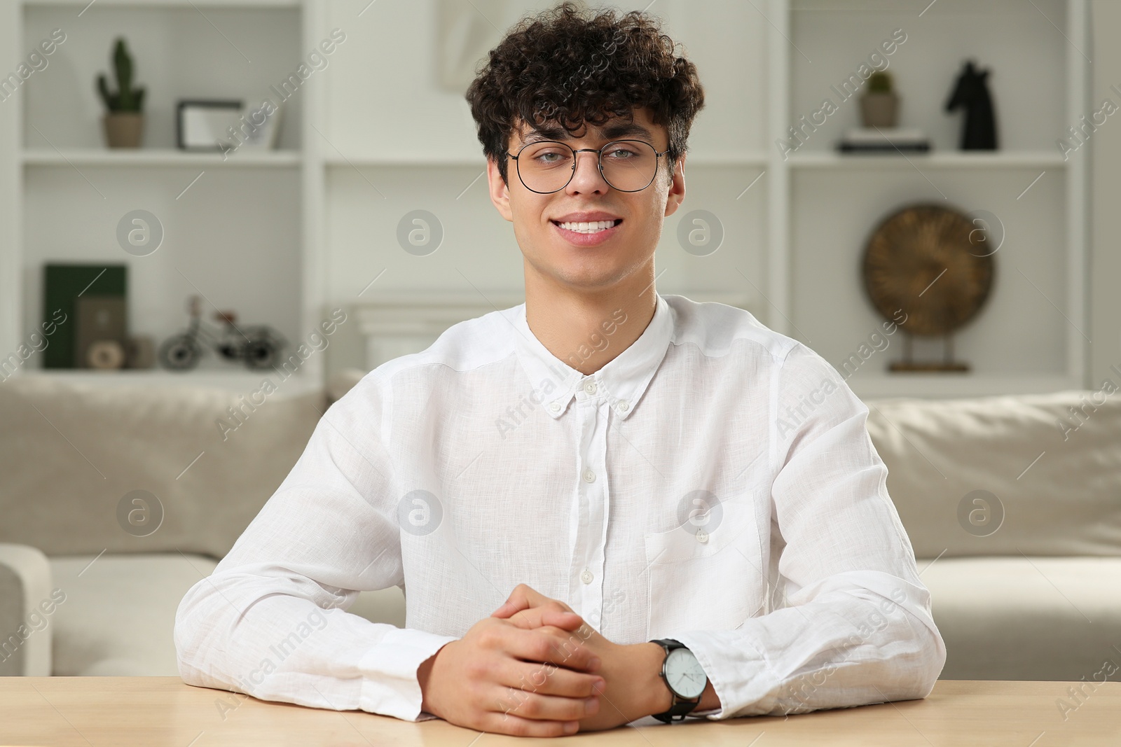 Photo of Young man having online video call at home, view from web camera