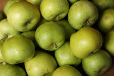 Photo of Fresh ripe green apples as background, closeup