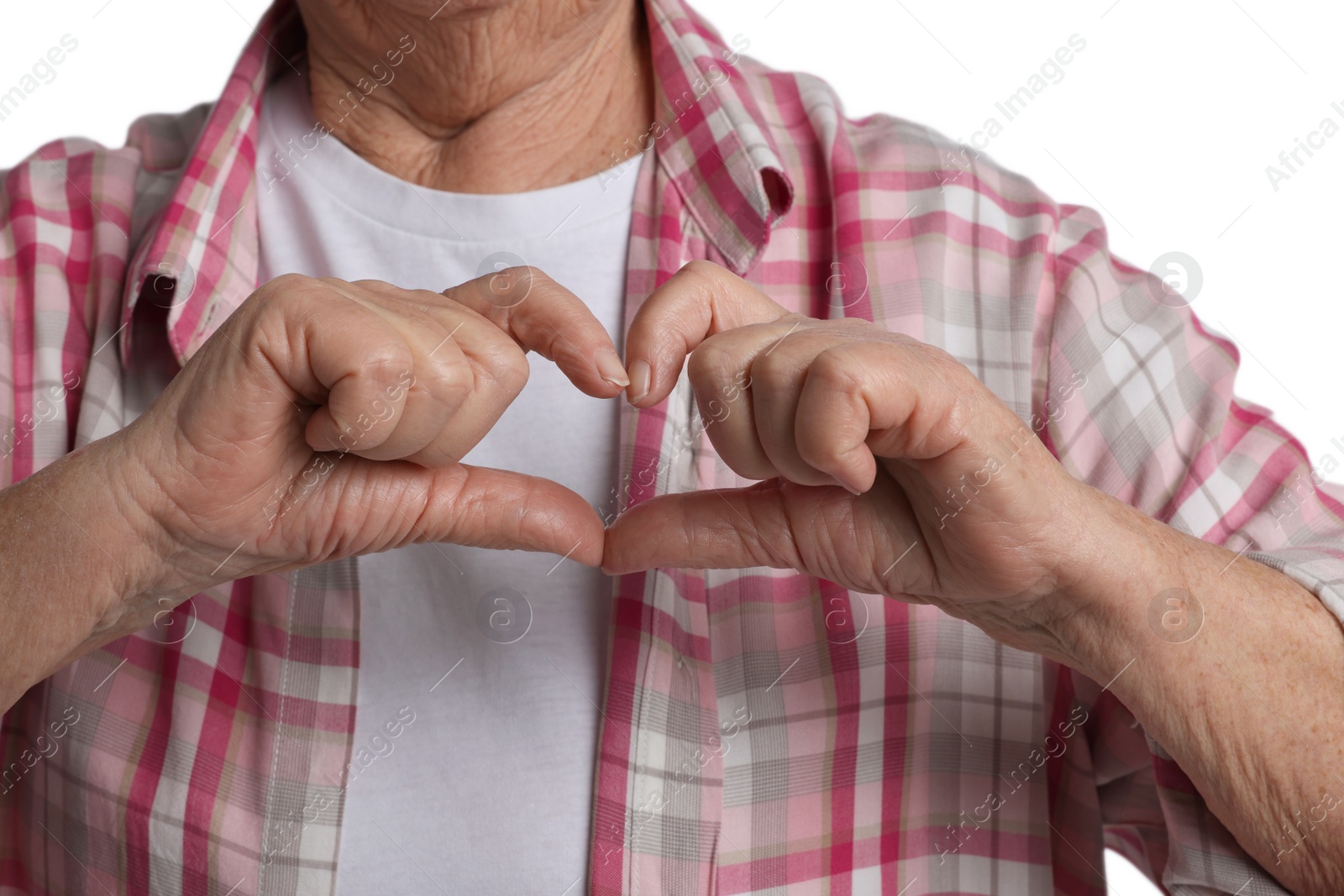 Photo of Elderly woman making heart with her hands on white background, closeup