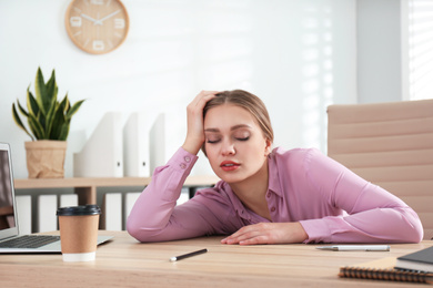 Photo of Lazy office worker sleeping at desk indoors
