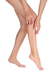 Woman with beautiful long legs on white background, closeup