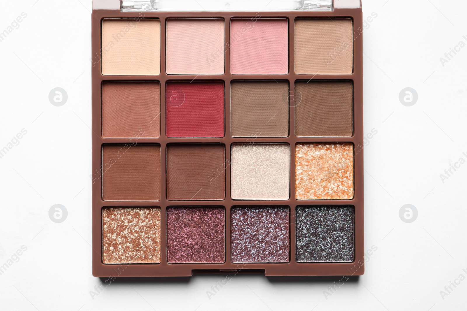 Photo of Beautiful eye shadow palette on white table, top view