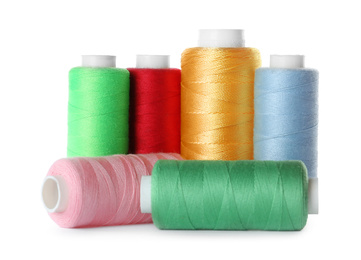 Photo of Set of color sewing threads isolated on white