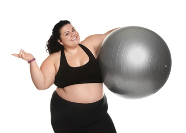 Overweight woman with fit ball on white background