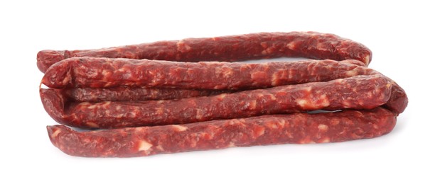 Thin dry smoked sausages isolated on white