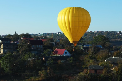 Photo of Beautiful viewhot air balloon flying over countryside