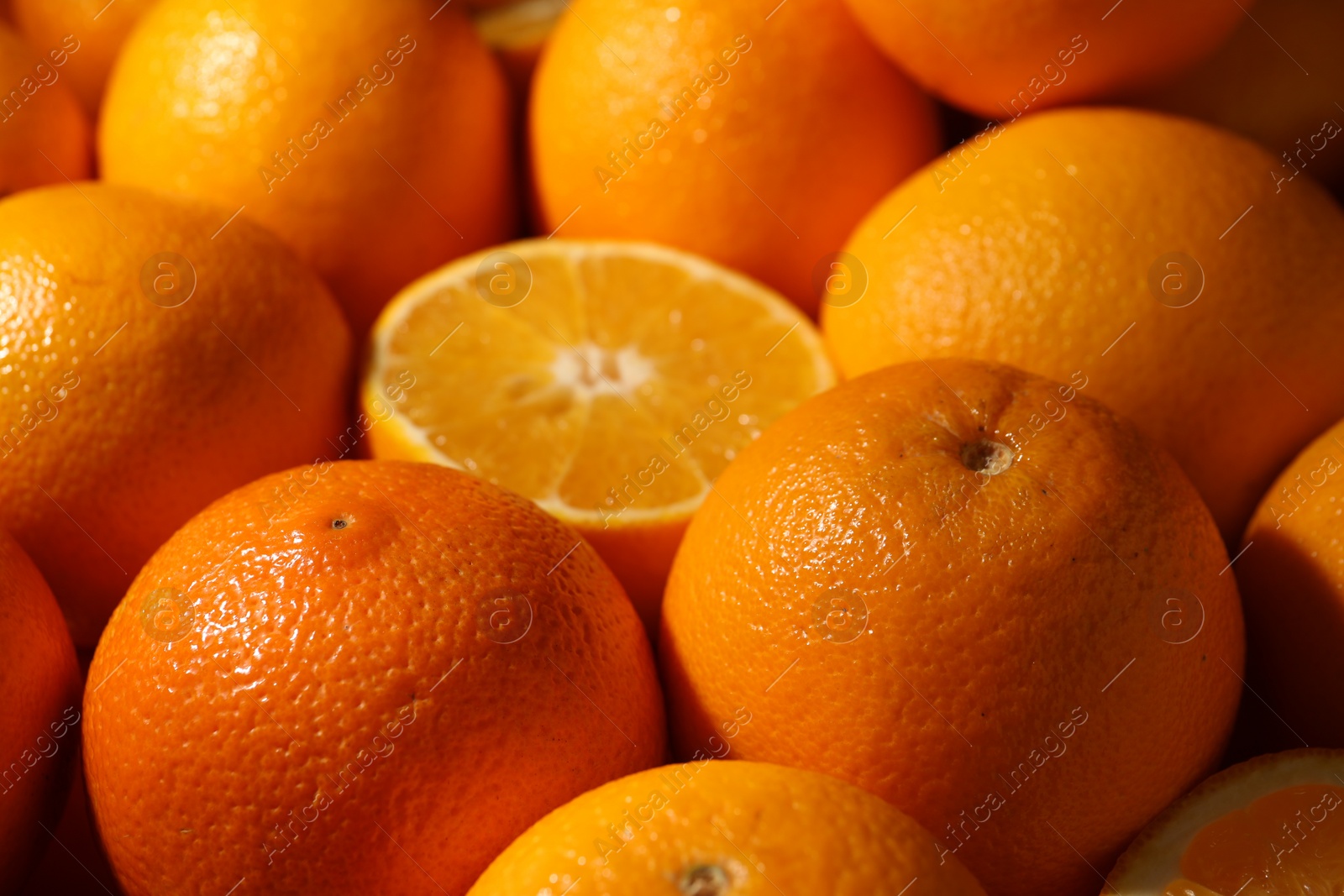 Photo of Tasty ripe fresh oranges as background, closeup