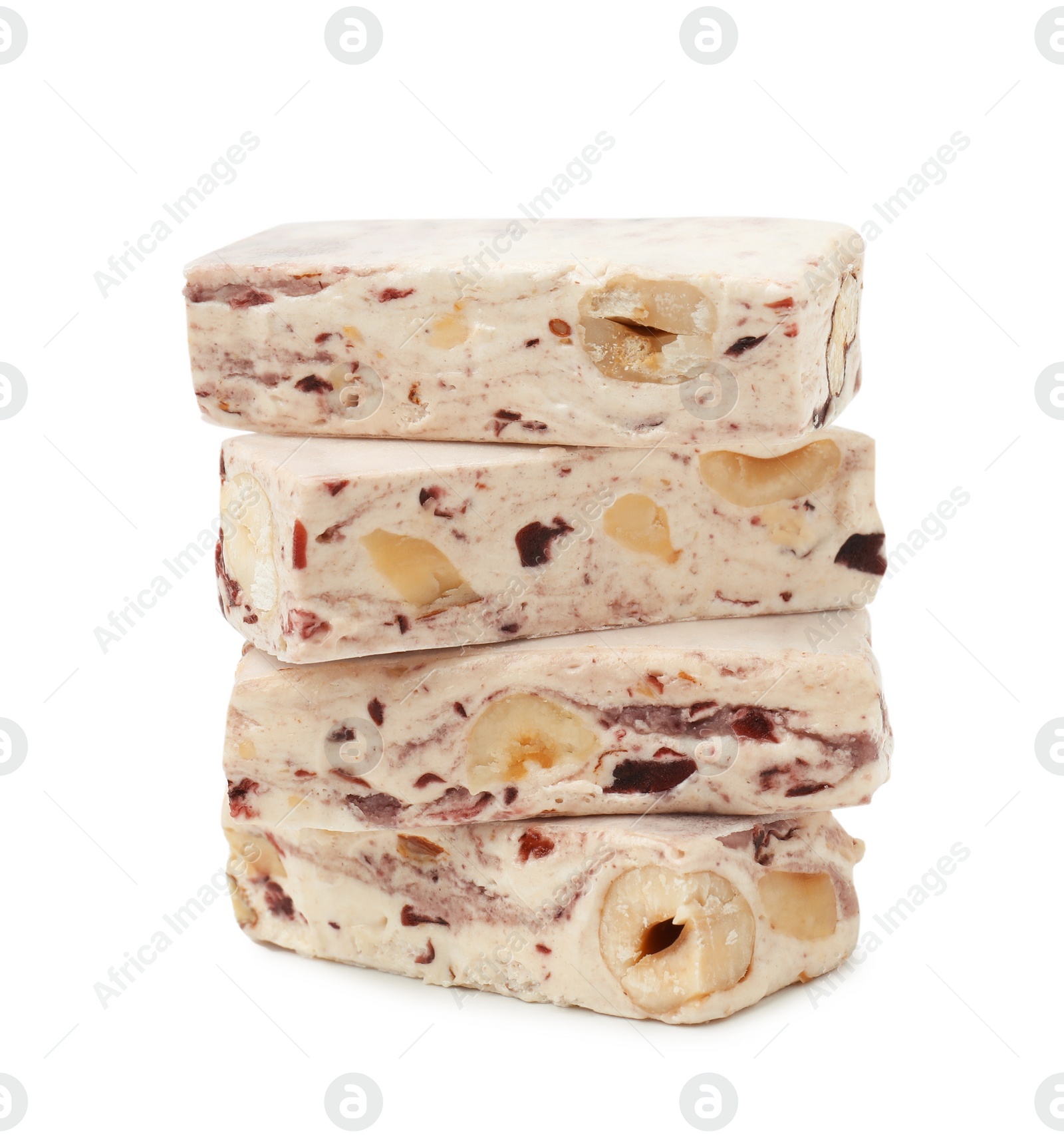 Photo of Pieces of delicious nougat on white background