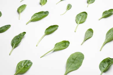 Photo of Fresh green healthy spinach on white background