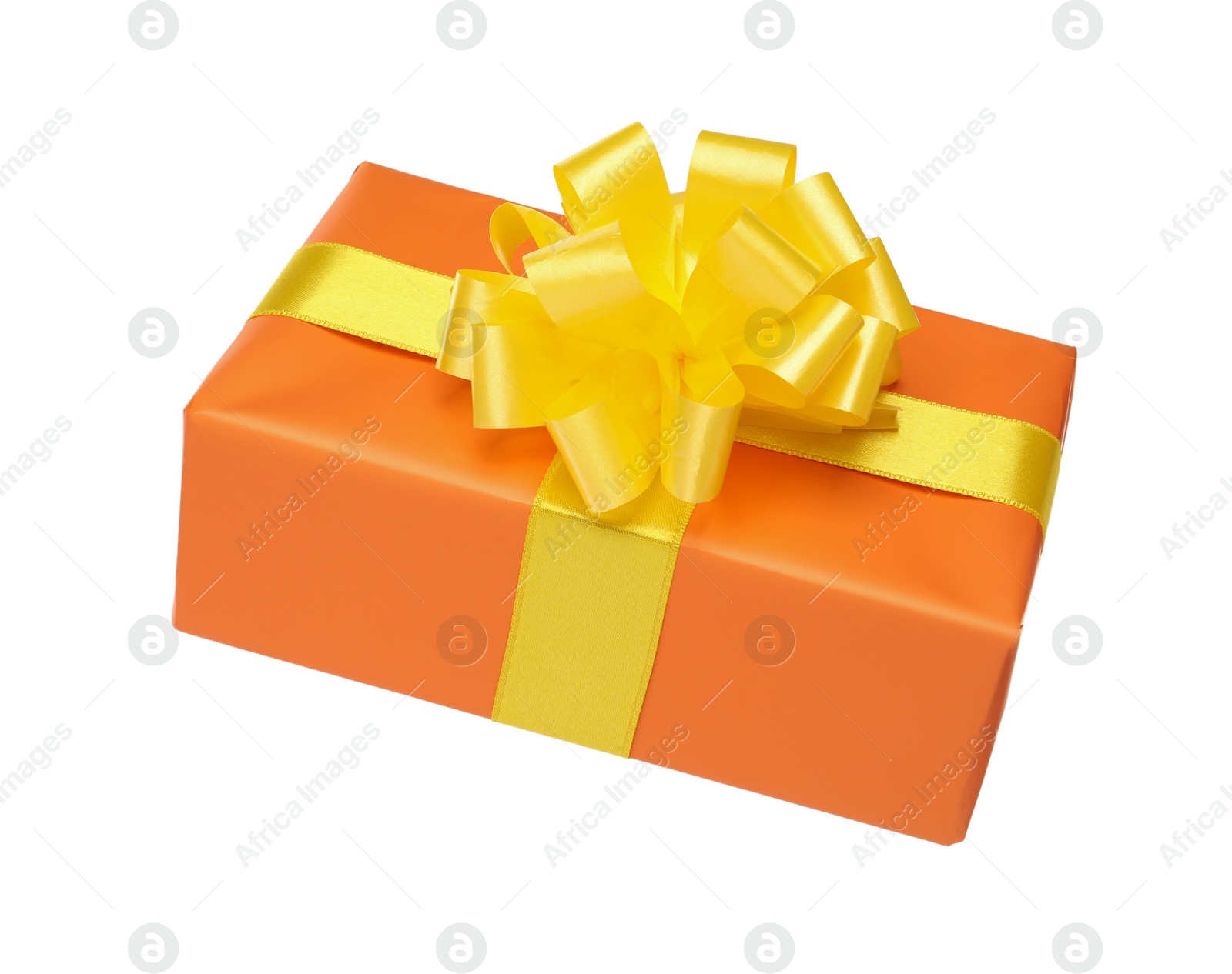 Photo of Orange gift box with yellow bow isolated on white