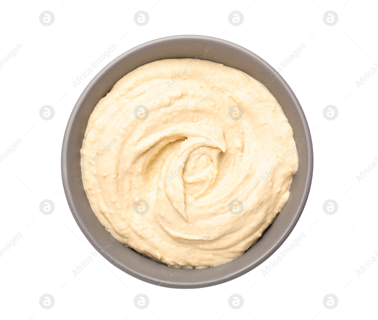 Photo of Tasty hummus in bowl isolated on white, top view