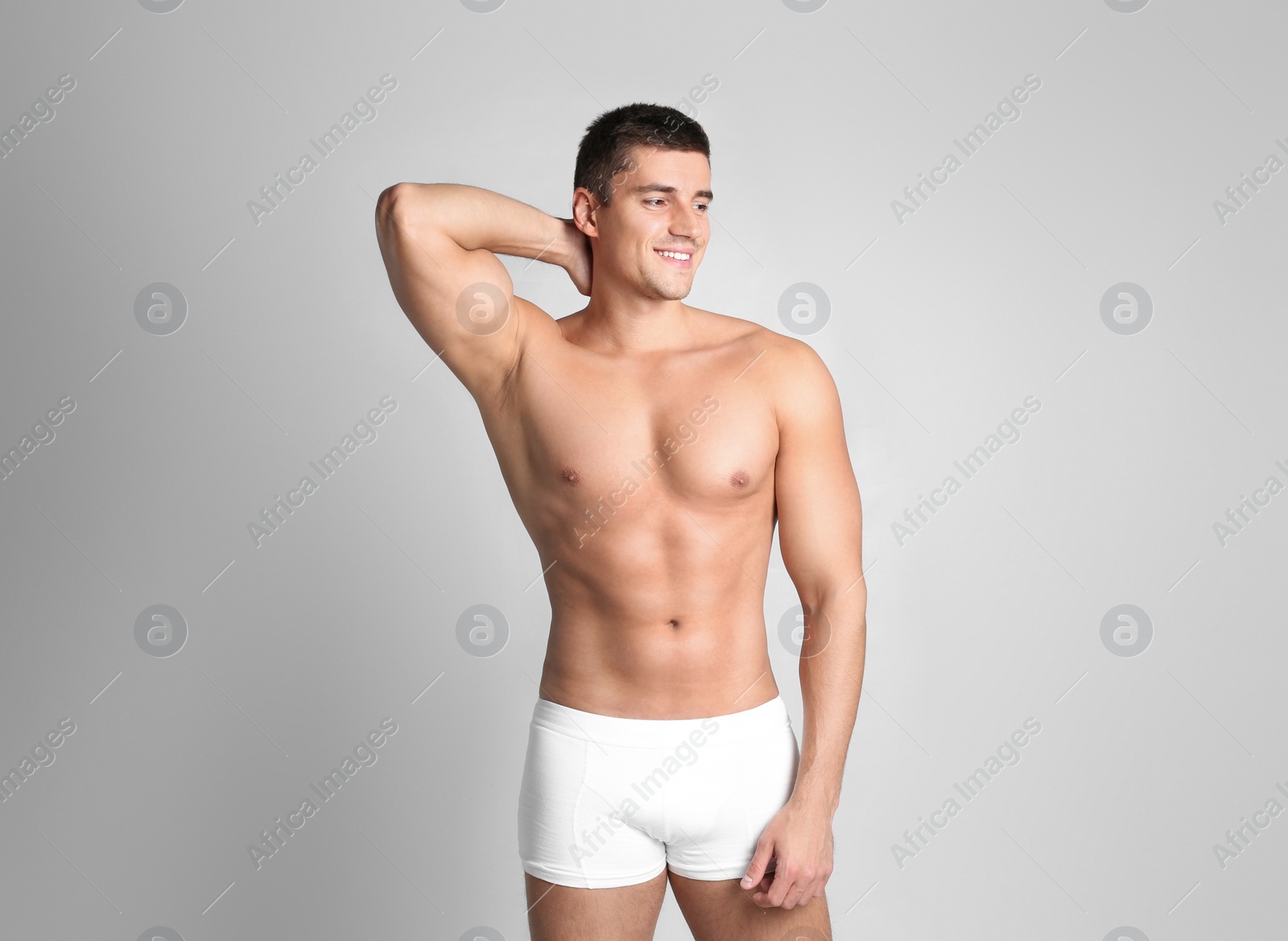 Photo of Man with sexy body on light background