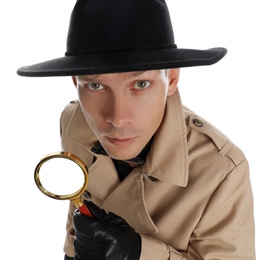 Photo of Male detective with magnifying glass on white background