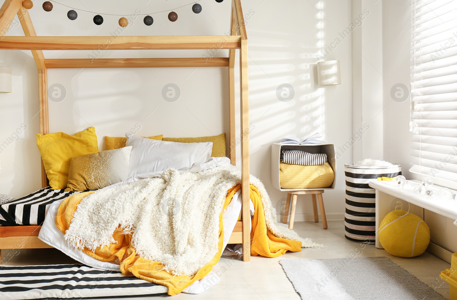 Photo of Cozy child room interior with comfortable bed