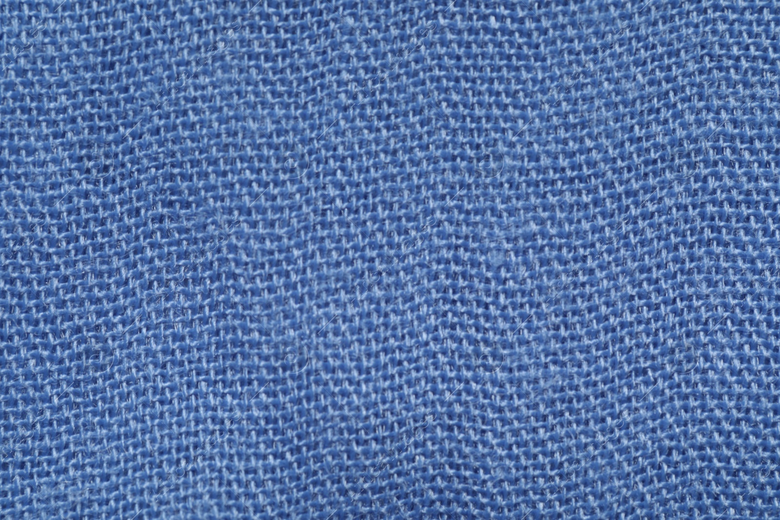 Photo of Texture of soft blue fabric as background, top view