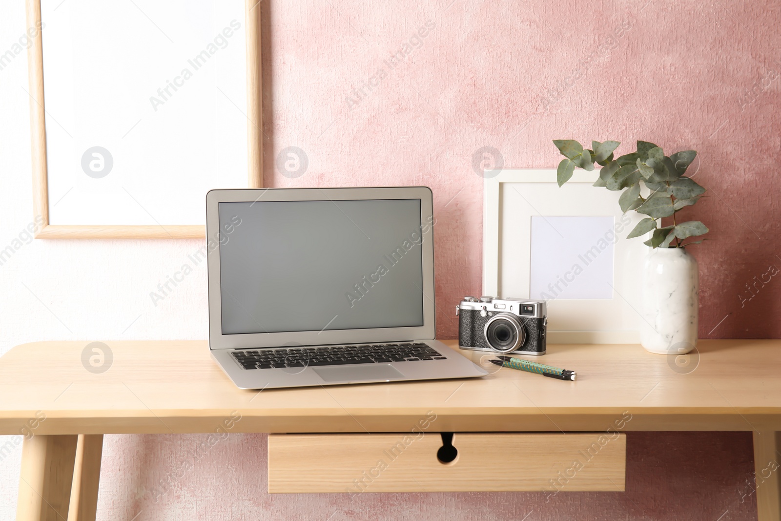 Photo of Cozy blogger workplace with laptop at home