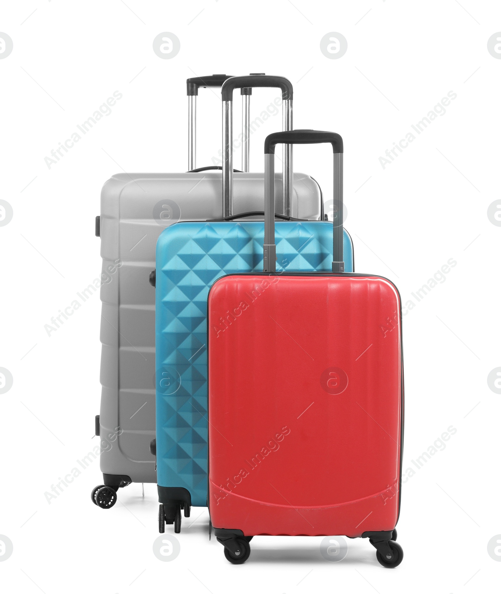 Photo of New suitcases packed for journey on white background