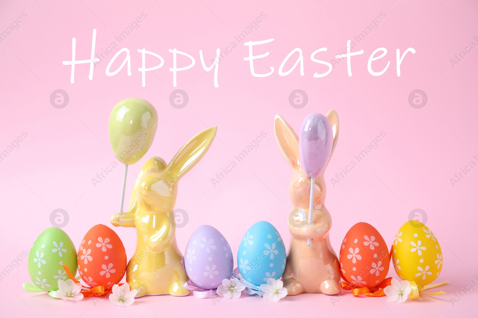 Image of Easter bunnies and painted eggs on pink background