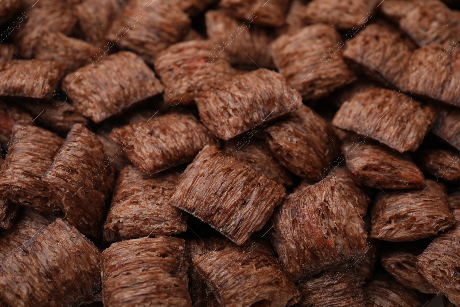 Photo of Tasty chocolate cereal pads as background, closeup