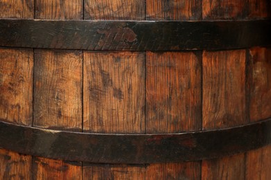 Traditional wooden barrel as background, closeup. Wine making