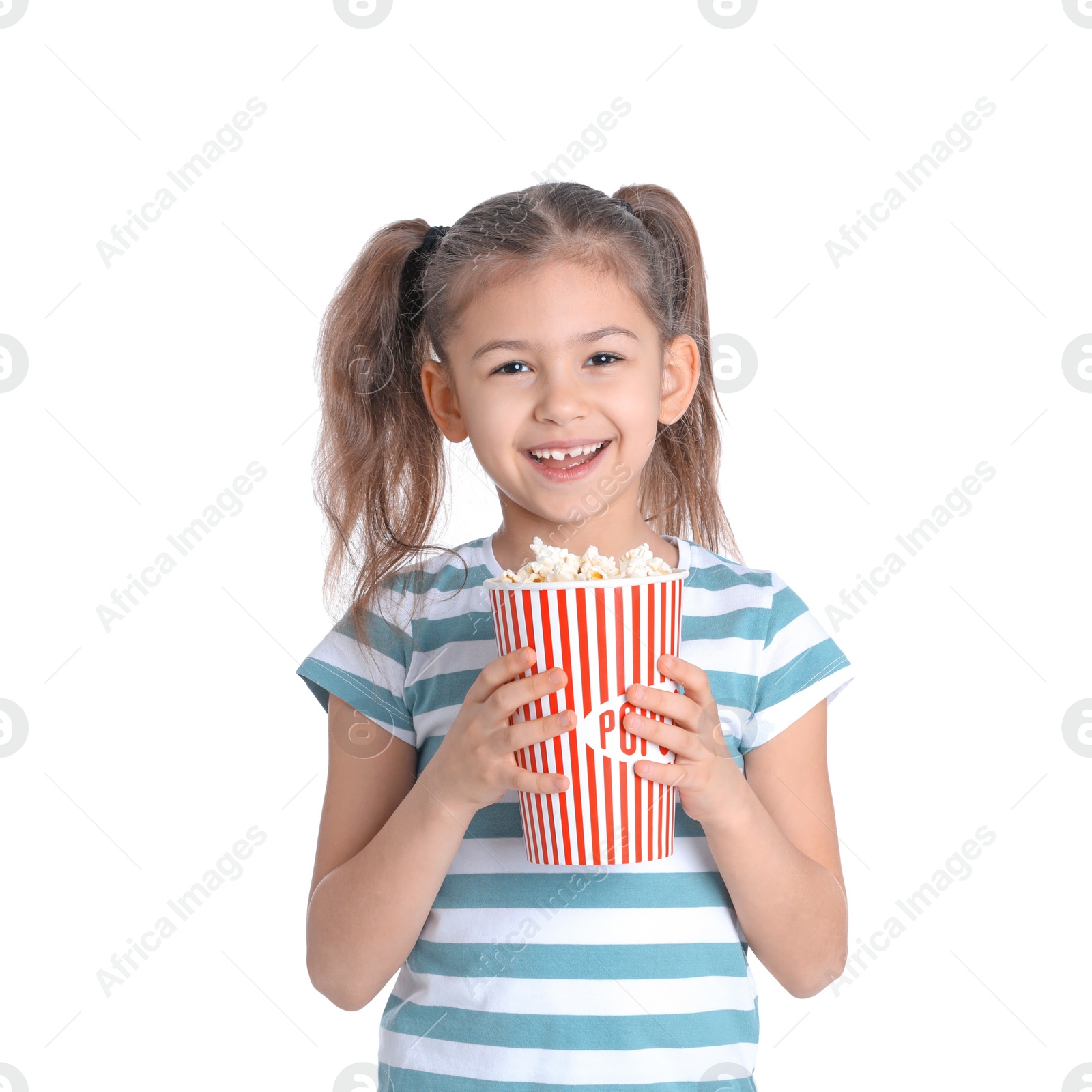 Photo of Cute little girl with popcorn on white background