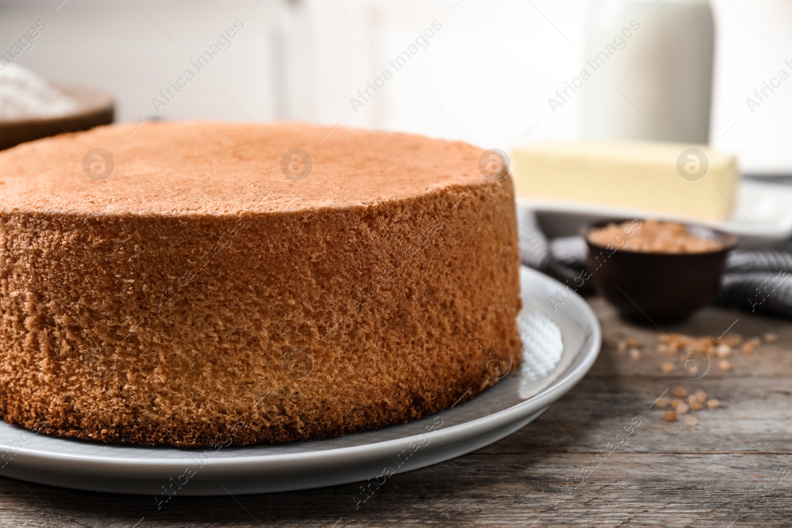 Photo of Delicious fresh homemade cake on wooden table, closeup